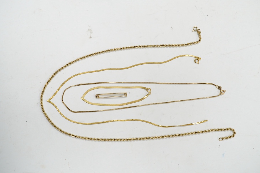 Four assorted 9ct gold chains or necklaces and a 9ct gold bar brooch, 14.7 grams. Condition - fair to good